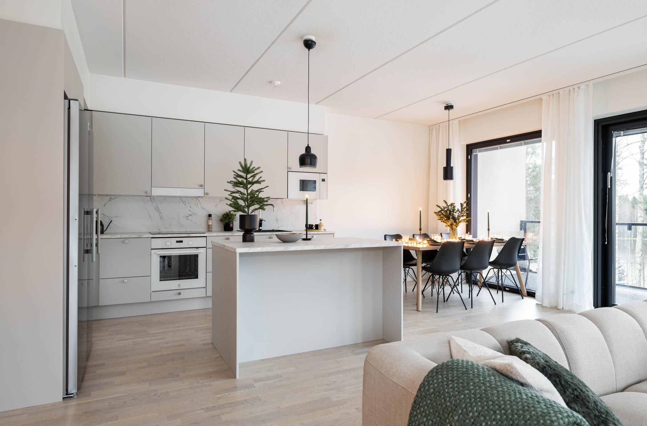 Kuva mallikalustetusta kolmiosta